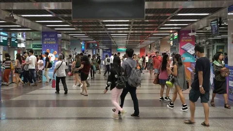 Commuting metro passengers walk to station platform Singapore Stock-Footage 78459622