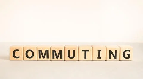 Commuting symbol. Concept word Commuting on beautiful wooden blocks. Beauti.. Stock Photos