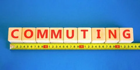 Commuting symbol. Concept word Commuting on beautiful wooden blocks. Beauti.. Stock Photos