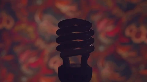 Comnpact Fluorescent light bulb turns on Stock Footage 103783885