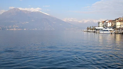 The Como lake view with the Alps mountains and a part of Bellagio village  Vídeos de archivo 123790033