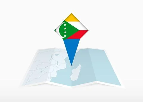 Comoros is depicted on a folded paper map and pinned location marker with f.. Stock Illustration