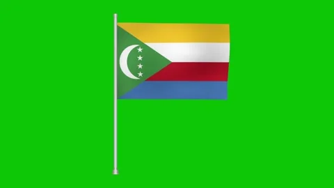 A comoros flag waving gently against a bright green background on a silver pole Stock Footage 317543205