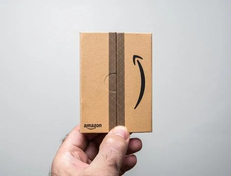 Compact Amazon Packaging in Hand Stock Photos