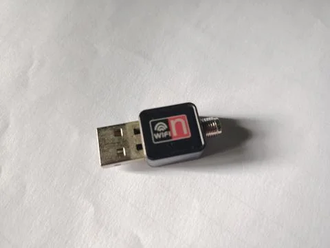 Compact black wireless USB adapter with WiFi and letter n symbol for enhanc.. 스톡 사진