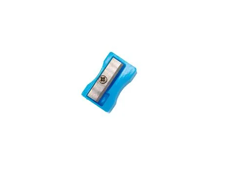 Compact blue pencil sharpener on a clean white background. Practical stationery Stock Photos