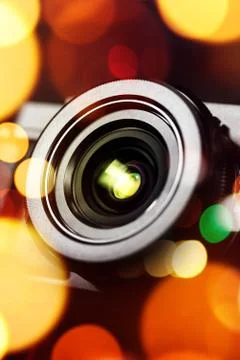 Compact camera lens with bokeh light Stock Photos