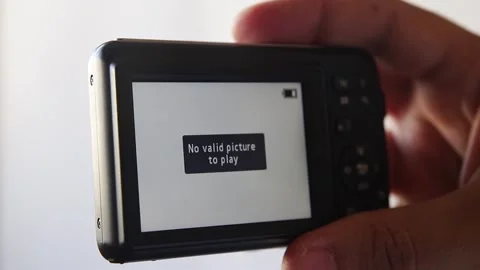 Compact camera in male hand. No valid picture to play Stock Footage 139936980