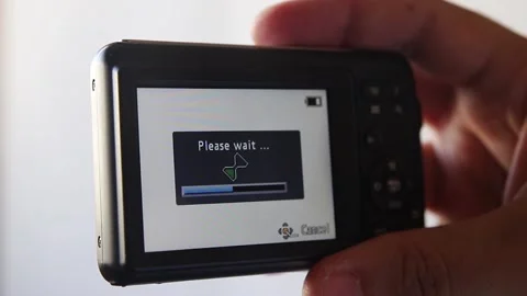 Compact camera in male hand. Reset. Please wait. Stock Footage 139936870