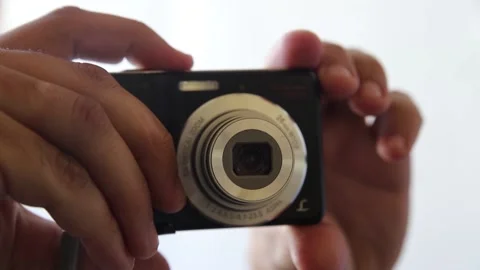 Compact camera in male hand. Turn off Stock Footage 139935168