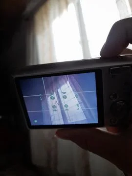 Compact camera taking picture of a window Stock Photos