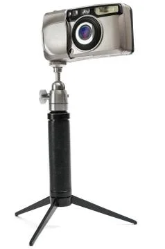 Compact camera on a tripod isolated on white background 스톡 사진