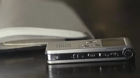 Compact dictaphone digital audio recording device CLOSE-UP SLIDE shot Stock Footage 304317487