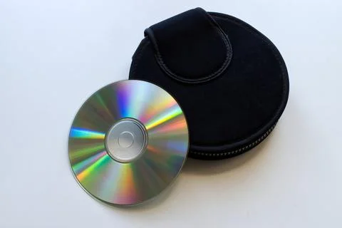 Compact disc and a black case on white background. Technology from the 90s. Stock-Fotos
