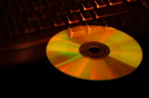 Compact disc and keyboard Stock Photos