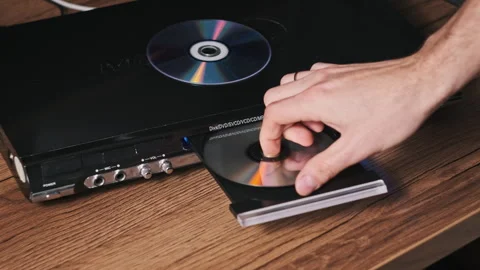 The Compact Disc is Inserted Into The DVD Player Video stock 260913681