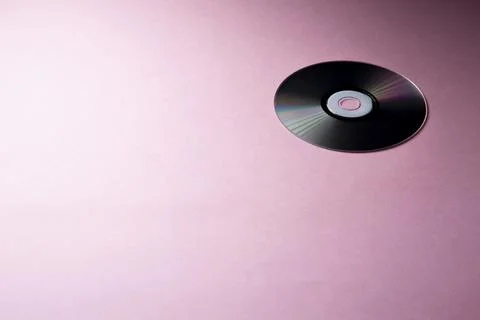 Compact disc on pink background Stock Photos