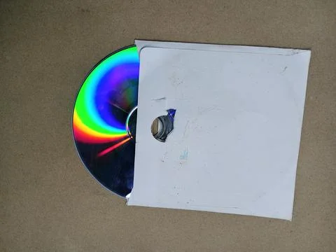Compact disc in white paper sleeve envelope Stock Photos