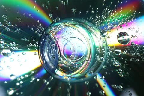 Compact discs with drops as background, closeup Stock Photos