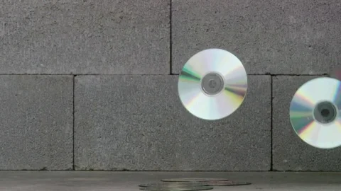 Compact discs falling onto ground Video stock 75251029