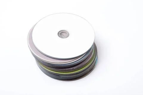 Compact discs in a pile Many compact discs in a pile, one on top of the ot... 写真素材