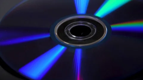 Compact disk isolated on black background. Abstract macro close up of colorful Stock Footage 85020332
