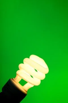 Compact flourescent on green Stock Photos