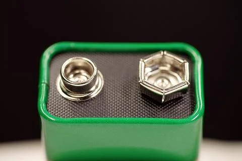 Compact green 9-volt battery isolated, electric battery with terminals supp.. Stock Photos