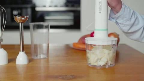 Compact handheld food chopper quickly slices onion into small pieces Stock Footage 244442301