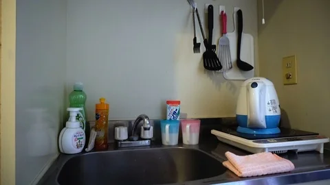 Compact Japanese Kitchen in Tiny Apartment Video stock 104481149