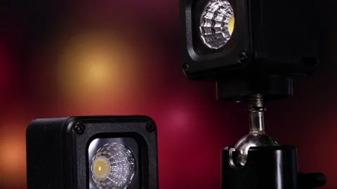 Compact led spotlight with adjustable mount on dark background Stock Footage 345262886