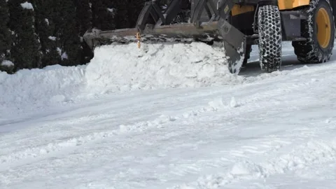 Compact Loader Clearing Accumulated Snow Beside Driveway Stock Footage 347885028
