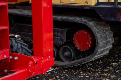 Compact loader crawler track with hydraulic drive motor assembly Stock Photos