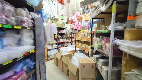 Compact Mart In Asia Filled With Boxes And Grocery Items - Dolly Forward Stock Footage 147380333