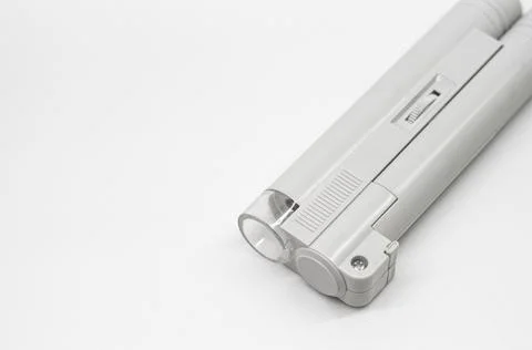 Compact mini microscope for printing and design. Magnifying device. Selective Stock Photos