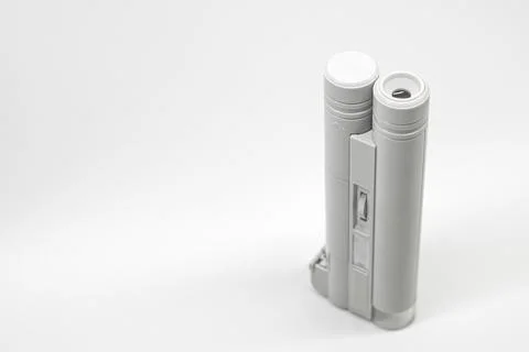 Compact mini microscope for printing and design. Magnifying device. Selective Stock Photos