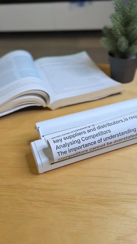 Compact Portable Scanner with Open Book on Wooden Desk – Education and Office Vidéo 317678306