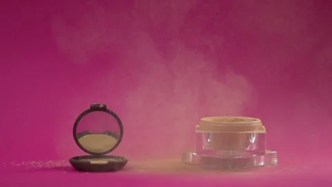 Compact powder box and jar with crumbly powder in the frame. Stock Footage 77582495