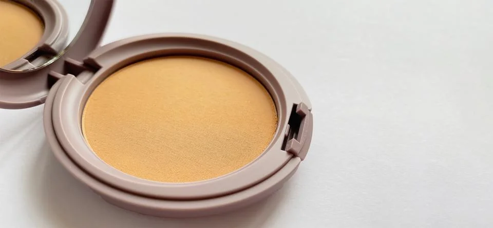 Compact powder for natural color make-up close-up isolated on a white background Stock Photos