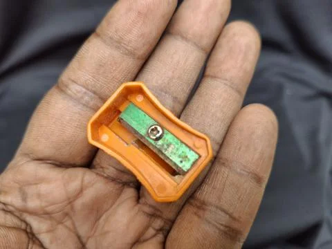 Compact single-hole pencil sharpener Stock Photos