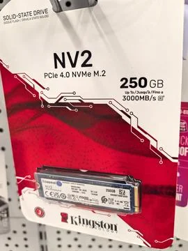 A compact, sleek solid-state drive is displayed prominently in a retail setti Stock Photos