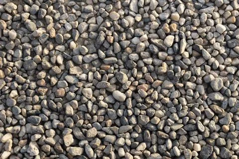 Compact soil composed of medium-fine gravel, sunset light Stock Photos