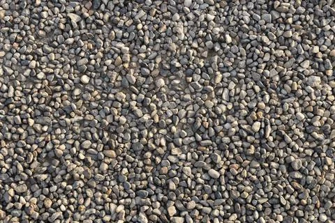 Compact soil composed of medium-fine gravel, sunset light Stock Photos