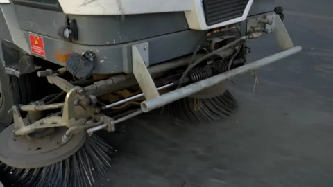Compact street cleaner machine cleans the street garbage using sweeping brushes Stock Footage 155081254