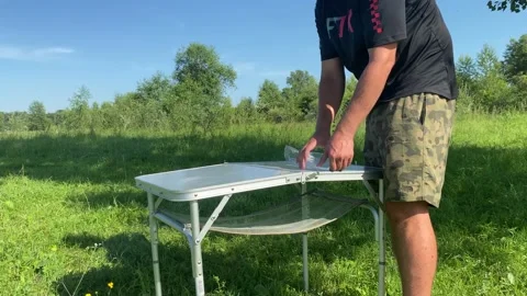 Compact table for cooking in nature Stock Footage 157432865