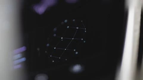 Compact three-dimensional mesh of connected blue nodes floats at the center 動画素材 343377754