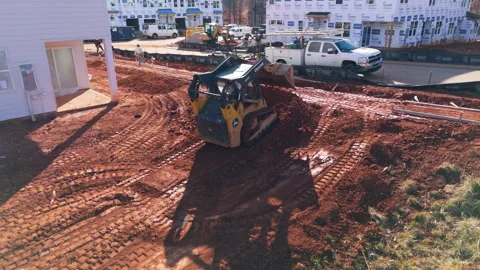 Compact Track Loader Performing Site Preparation Work For New Construction. - Stock Footage 337555149