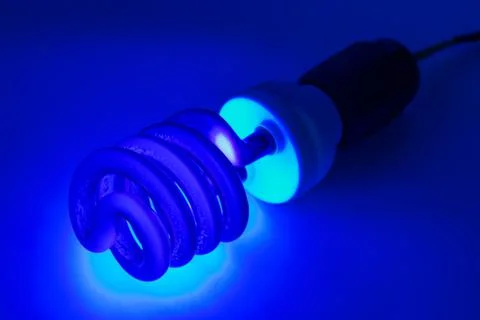 Compact UV - ultraviolet CCFL - Cold Cathode Fluorescent Lamp on white surface Stock Photos