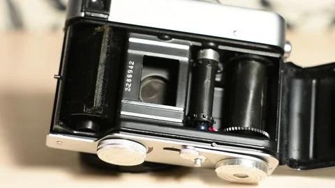 Compact vintage half-frame camera Stock Footage 121506371