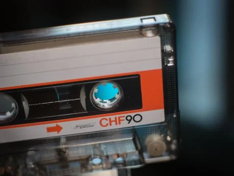 Compact white orange cassette closeup. Stock Photos